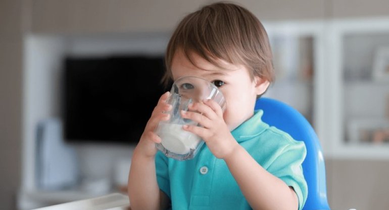 1780666878_cute-toddler-boy-drinking-milk-600nw-1936608706
